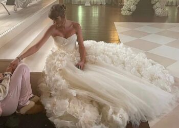 Taylor Swift has sparked speculation about the designer of her wedding dress after rumours that she met with Sarah Burton while in London. Pictured while filming I Bet You Think About Me in 2021