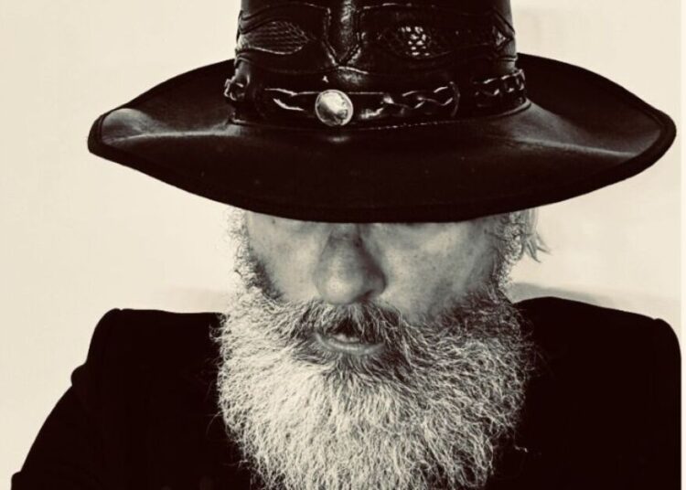 The ills of social media are explored in a new rock song from George Paul Smith called "Alive"