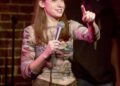 Comedian Chloe Radcliffe on stage as her character, Nina, in "Is This Thing On?"