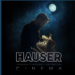 Album cover for Cinema by Hauser with the London Symphony Orchestra, showing a man playing a cello under a bright moon against a smoky blue background.