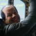 Mark Wahlberg smiles as he's being held in captivity in Flight Risk.