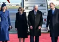 Reuters Four people walk on red carpet in front of a plane with Catherine wearing a blue jacket, and Elke Budenbender wearing a black dress, Frank-Walter Steinmeier wearing a black suit jacket and William wearing a black suit jacket