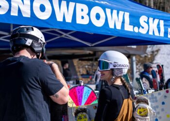 Two guests participating in a Collision Camp raffle