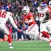 New England Patriots quarterback Drake Maye (10) runs with the ball against New York Giants linebacker Zaire Barnes (46).