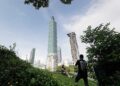 Alex Honnold's climb of Taipei 101 skyscraper delayed by 24 hours