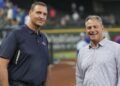 Jun 21, 2024; Arlington, Texas, USA; Texas Rangers general manager Chris Young (left) and Kansas City Royals general manager J.J. Picollo (right) talk before the game against the Kansas City Royals at Globe Life Field. Mandatory Credit: Jim Cowsert-Imagn Images