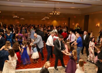 a room of people dancing