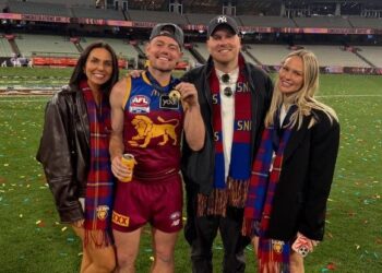 Lachie Neale and Jules Neale with Ben Crosley and Tess Crosley after Brisbane's 2025 grand final win.