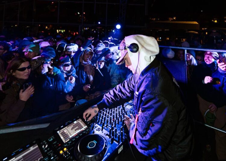 A DJ plays for a crowd.