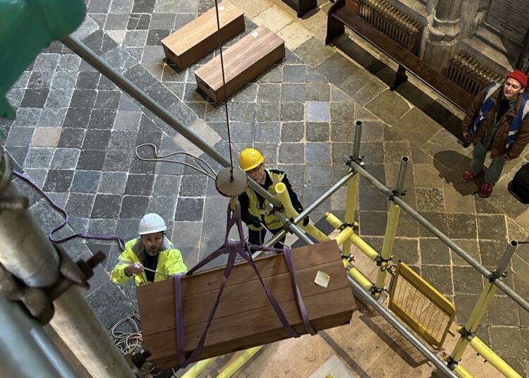 Bones reinterred in Winchester Cathedral mortuary chests after more than a decade of analysis and reorganisation