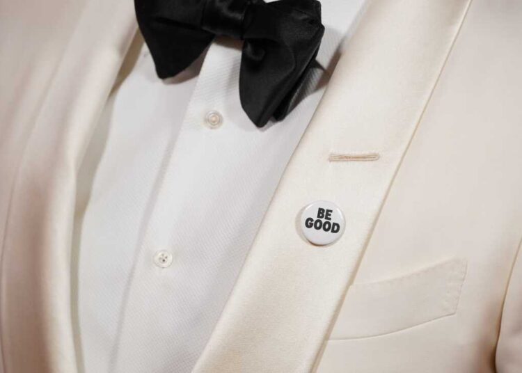 Mark Ruffalo, wearing a "Be Good" pin, arrives at the 83rd Golden Globes on Sunday, Jan. 11, 2026, at the Beverly Hilton in Beverly Hills, Calif.