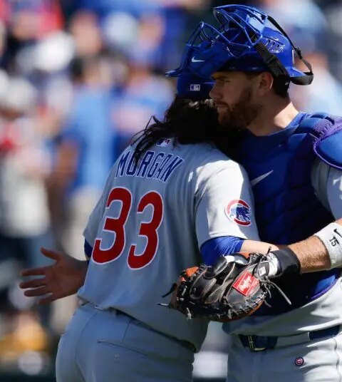 Chicago Cubs pitcher Eli Morgan (33) shakes hands with catcher Carson Kelly (15) after the game against the Athletics at Sutter Health Park.
