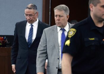 Nathan Chasing Horse walks into a courtroom alongside his attorney, Craig Mueller, during his sexual assault trial at the Regional Justice Center in Las Vegas.