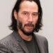 Man with medium-length dark hair and beard, wearing a gray blazer and black shirt, related to celebrity gossip discussions.