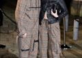 Brooklyn Beckham (left) and Nicola Peltz arriving at the Burberry show at Tate Britain, London (Ian West/PA)