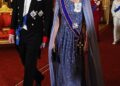 Kate dazzled in an intricately beaded sequin cape dress with dramatic draping for the German state banquet, stepping out in a glittering cornflower blue Jenny Packham gown, teamed with Gianvito Rossi pumps and an Anya Hindmarch clutch