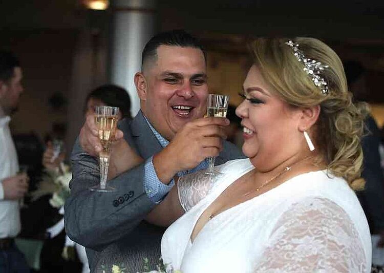 Oscar Rios and Marena Garcia, both of Bryant, got married in the 2025 Valentine's Day group wedding at North Little Rock's Laman Library.  (Democrat-Gazette file photo/Thomas Metthe)