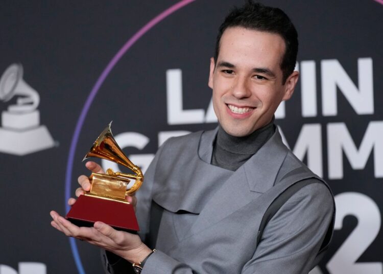 Edgar Barrera poses with a Grammy at the 23rd annual Latin Grammy Awards on Nov. 17, 2022, in Las Vegas. (AP Photo/John Locher, File)