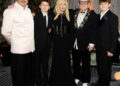 Andrew Archeos David Furnish and Elton John pose with Donatella Versace (center) and their sons Zachary, 14, and Elijah, 12