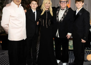 Andrew Archeos David Furnish and Elton John pose with Donatella Versace (center) and their sons Zachary, 14, and Elijah, 12
