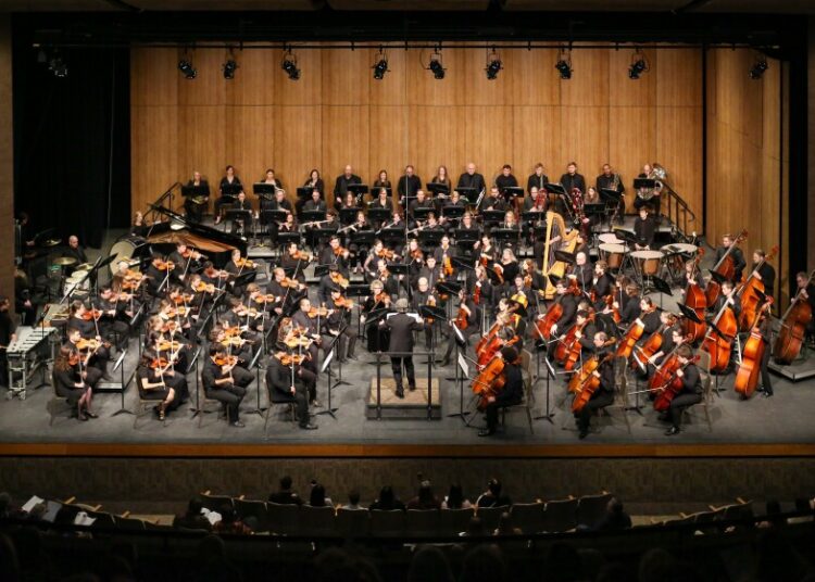 Members of the FM Youth Symphony play alongside the FM Symphony Orchestra on the song, "Rainbow Body" by Christopher Theo Fanidis, the first song of Saturday night's concert on Jan. 18, 2025, at Festival Concert Hall, NDSU.