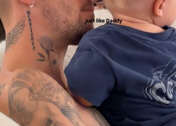 Justin Bieber holding his son, Jack.