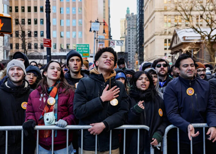 People attend a block party to mark the inauguration of Zohran Mamdani as the new Mayor of New York City, at Canyon of Heroes along Broadway, in New York City on Jan. 1, 2026.