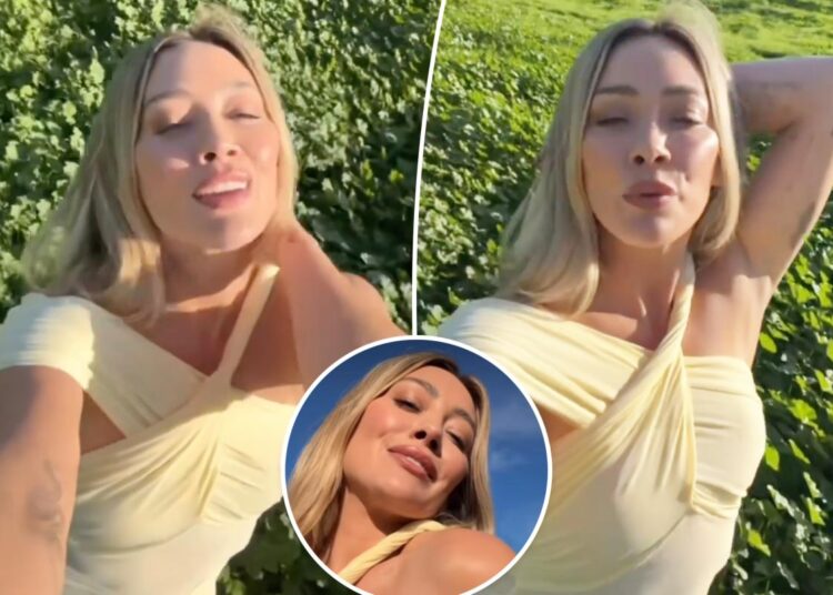 Hilary Duff teases new song wearing semi-sheer minidress amid mom group drama