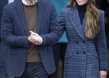 The Princess of Wales dazzled in a custom tartan coat designed by a famed Savile Row tailor as she arrived in Scotland for a day of joint engagements with Prince William on Tuesday