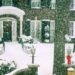 snowcovered house entrance with holiday decorations
