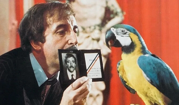Inspector Jacques Clouseau shows off his badge to a parrot in "The Pink Panther Strikes Again" (1976)