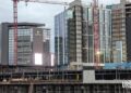 Images: Another sizable Centennial Yards building has topped out
