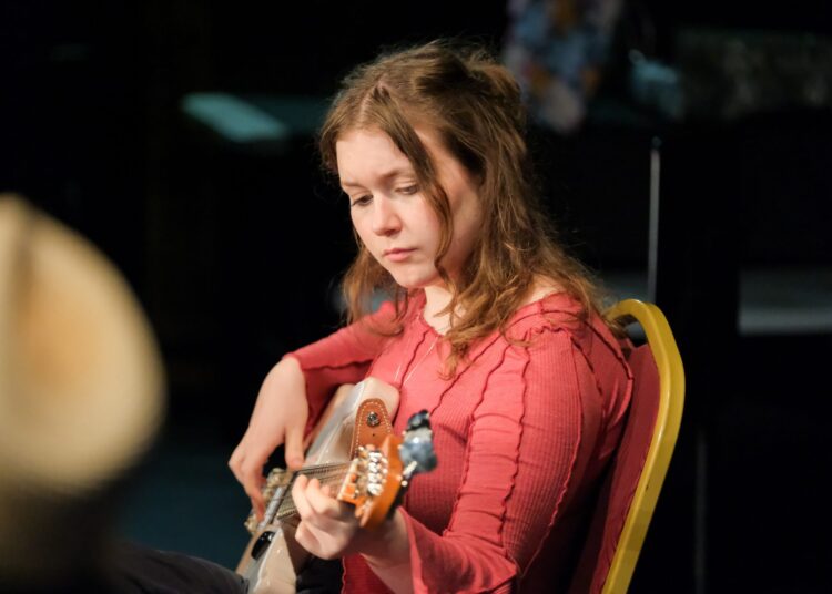 Clara Smith ’26 rehearses a Somali love song for a collaborative performance at the Faribault Paradise Center for the Arts. Photo by Rehanna Kheshgi
