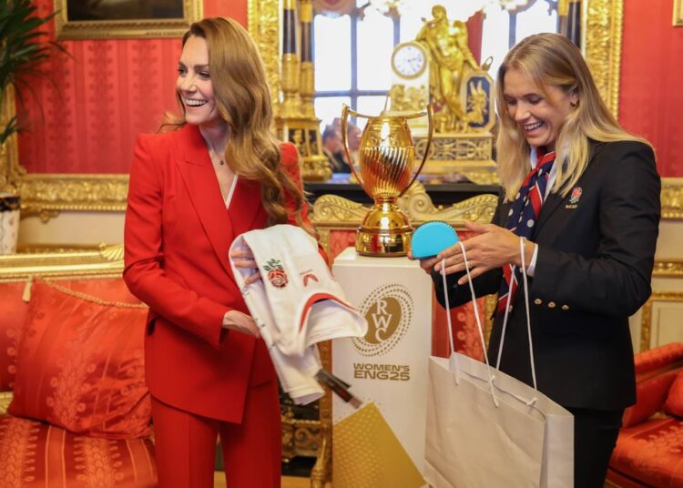 Kate stood next to the World Cup trophy
