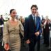 former prime minister justin trudeau holds hands with katy perry as they leave an event during the world economic forum in davos, switzerland on tuesday, jan 20, 2026