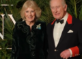 King Charles and Queen Camilla smile at a film premiere