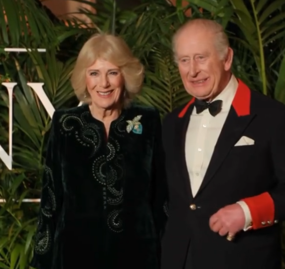 King Charles and Queen Camilla smile at a film premiere