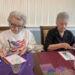 Crafting club members Margaret Kasyan and Martha Aregood work on...