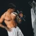 Image may contain Person Skin Tattoo Adult Face Head Bicep Curls Fitness Gym Gym Weights Sport and Working Out