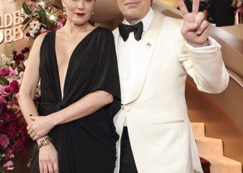 Mark Ruffalo and other A-listers honored the memory of Renee Good and protested the US Immigration and Customs Enforcement (ICE) agency on the red carpet of the 83rd Golden Globes on Sunday; pictured with his wife Sunrise Coigney