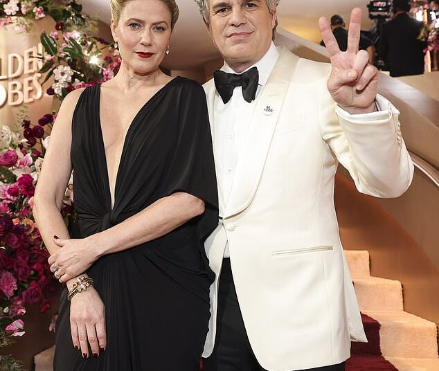 Mark Ruffalo and other A-listers honored the memory of Renee Good and protested the US Immigration and Customs Enforcement (ICE) agency on the red carpet of the 83rd Golden Globes on Sunday; pictured with his wife Sunrise Coigney
