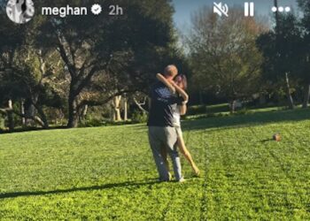 Couple sharing an embrace in a park.