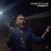 Image may contain Morrissey Head Person Face Photography Portrait Adult Clothing Coat Body Part Finger and Hand