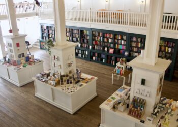 the inside of a bookstore from the second floor