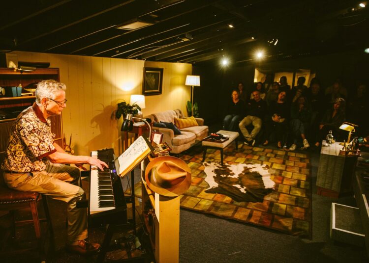 Justin Tanner plays the keyboard onstage during "My Son the Playwright."