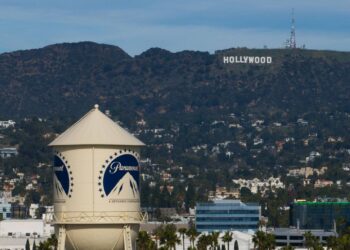 The Paramount Pictures water tower is seen in Los Angeles, Thursday, Dec. 18, 2025, with the Hollywood sign in the distance. (AP Photo/Jae C. Hong, File)