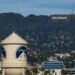 The Paramount Pictures water tower is seen in Los Angeles, Thursday, Dec. 18, 2025, with the Hollywood sign in the distance. (AP Photo/Jae C. Hong, File)