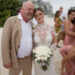 Rick Harrison wears tan suit with wife Angie in white bridal gown.