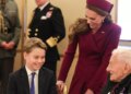 Prince George with mum Kate at a tea party for veterans at Buckingham Palace hosted by the Royal British Legion