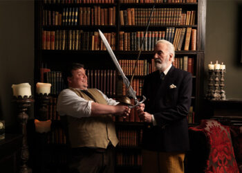 Craig Glenday sword fighting with Sir Christoper Lee